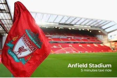 a red flag in front of a stadium at Relax Inn in Liverpool