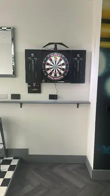 a dart board on top of a wall at The White House Vegas Suites in Blackpool