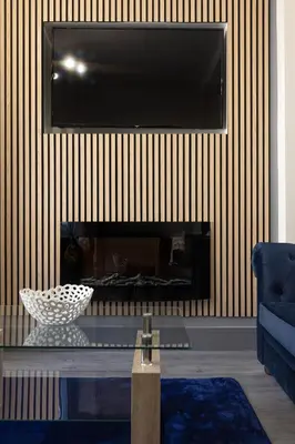 a living room with a tv above a fireplace at Teck House - Air Host & Stay - 5 mins to Hospital in Liverpool