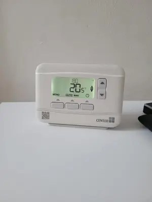 a digital clock sitting on top of a white table at House 36 in Liverpool