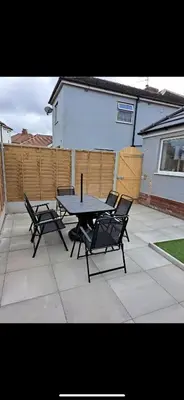 a patio with a table and chairs and a fence at Wave Stays - Ground Floor Apartment - Outside Seating Area in Cleveleys