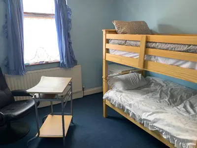 a bedroom with a bunk bed and a desk at Abbey Road in Liverpool