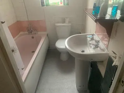 a bathroom with a sink and a toilet and a tub at Abbey Road in Liverpool
