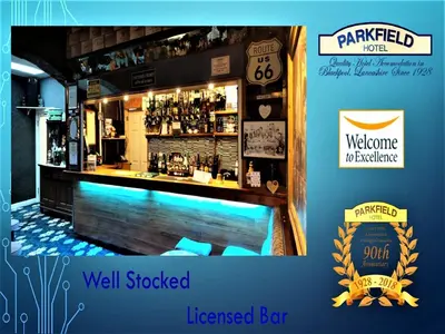 a rendering of a well stocked bar with a welcome sign at Parkfield Hotel in Blackpool