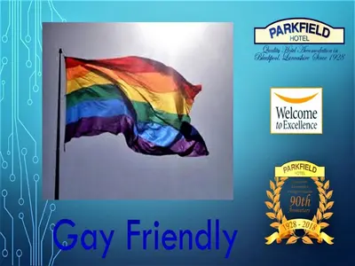 a flag with a rainbow flag on a wall at Parkfield Hotel in Blackpool