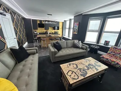 a living room with a couch and a coffee table at Swish Luxury Holiday Apartments in Blackpool
