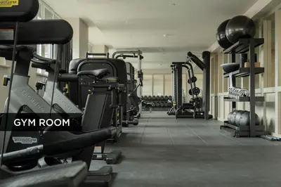a gym with a row of treadms and machines at LIVINGWAY Roco in Liverpool