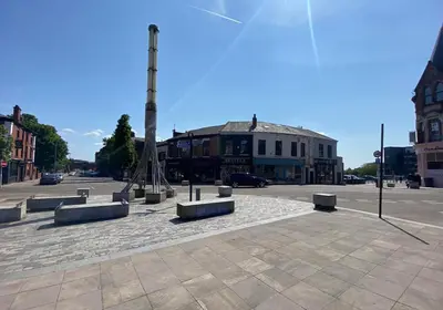 a square with a monument in the middle of a street at BEST CHOICE - Hotel Royal in Blackburn