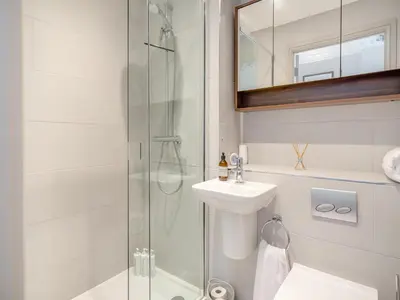 a bathroom with a shower and a sink at Mishmash in Arnside