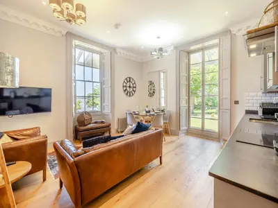 a living room with a couch and a table at Mishmash in Arnside