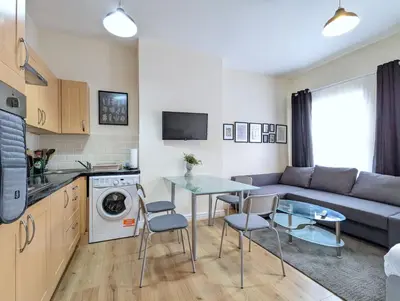 a living room with a couch and a table at Lovely Studio in Anfield Near Centre Free Parking in Liverpool