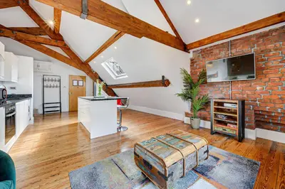 an open living room with a brick wall at Host & Stay - Bands Warehouse VI in Liverpool