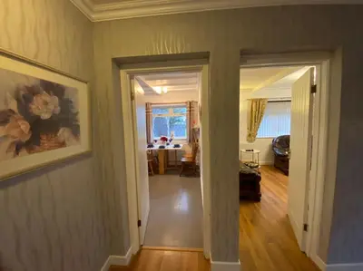 a hallway of a home with a living room at Quiet secluded two bedroom bungalow with parking in Cleveleys
