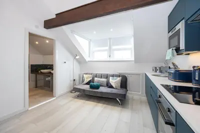 a living room with a couch in a kitchen at Morecambe Bay Free Parking By Beach Front Sea View in Morecambe