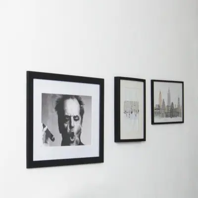 a group of four pictures hanging on a wall at GuestReady - Monochromatic Retreat in Liverpool