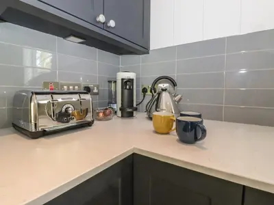 a kitchen counter with a toaster and a toaster at Hawthorn Croft in Ulverston