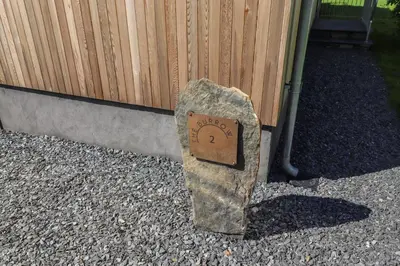 a rock sitting in front of a building at The Burrow in Ulverston