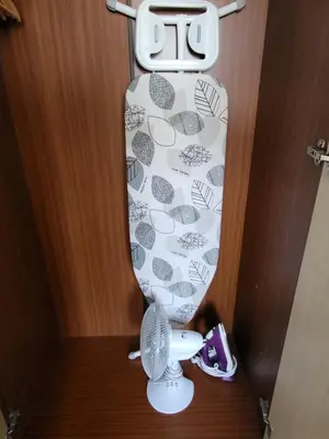 a toilet with a shower curtain and a fan at The Lumada in Blackpool