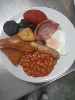 a plate of breakfast food with beans and eggs at The Lumada in Blackpool