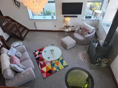 an overhead view of a living room with a television at The Dairy at Brackenthwaite Farm in Carnforth