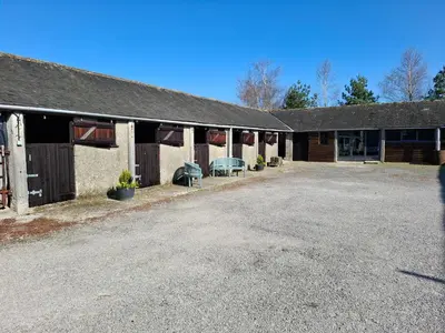 an empty parking lot in front of a building at The Coach House at Brackenthwaite Farm in Carnforth
