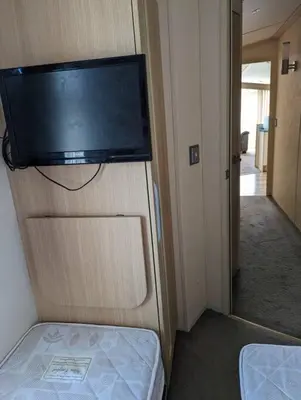 a flat screen tv on the wall of a room at 6 berth holiday home on Ocean Edge near Morecambe in Heysham