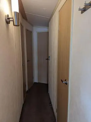 an empty hallway with two doors and a hallway at 6 berth holiday home on Ocean Edge near Morecambe in Heysham