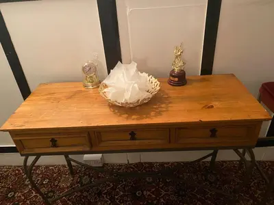 a wooden table with a bowl on top of it at Crosby Hotel in Blackpool