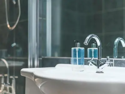 a bathroom with a sink and a mirror at Baltic Dockside Apartment, Free Parking in Liverpool