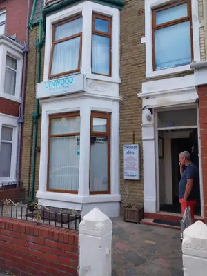 a man standing in the doorway of a building at Lynwood Hotel & Spa in Blackpool