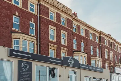 a red brick building with a sign in front of it at The Royal Boston Hotel by Compass Hospitality in Blackpool