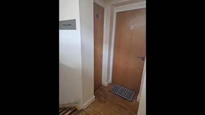 an empty hallway with a door and a room at Apt - Sleeps 7 - Walking Distance to Attractions in Liverpool