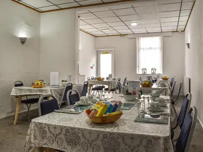 a conference room with tables and chairs with food on them at Apartment 786 At The Granville in Blackpool