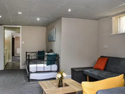 a living room with a couch and a bed at Apartment 786 At The Granville in Blackpool
