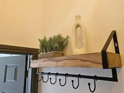 a shelf with plants on top of a door at Shakespeare's Snug in Prescot