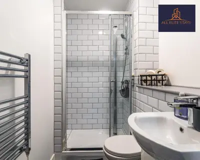 a bathroom with a shower and a toilet and a sink at Swan House Stunning 1 bed Apartment By ALL ELITE STAYS - near Liverpool city centre - Sleeps 4 - Free Parking in Liverpool