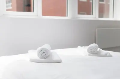 a bathroom counter with two rolls of toilet paper at Modern 1 Bedroom Apartment in Preston Centre in Preston