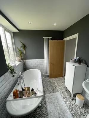 a bathroom with a bath tub and a sink at 1 Bedroom Sea side luxury in New Brighton