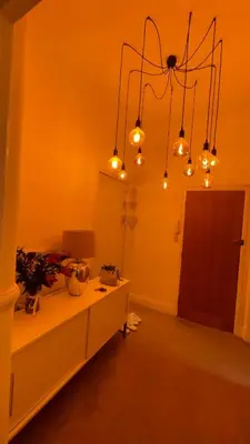 a room with a table with lights on it at 1 Bedroom Sea side luxury in New Brighton