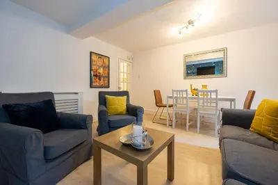 a living room with two couches and a table at GuestReady - Charming haven in Knowledge Quarter in Liverpool