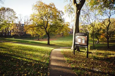 a path in a park with a sign at 7 Cannon Street in Preston