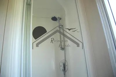 a bathroom door with a sign that reads reinvention panels at The Rivington Lodge in Heysham