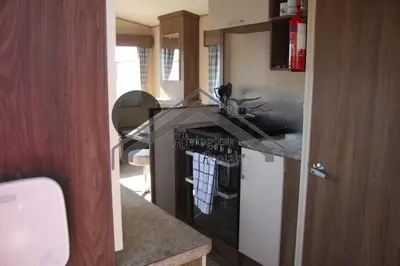 a kitchen with a sink and a counter top at The Rivington Lodge in Heysham