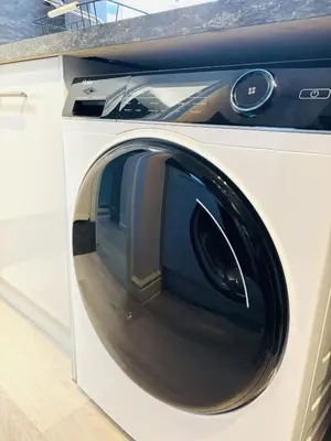 a white washing machine with its door open at Stylish 3BR house near Liverpool Football Club in Liverpool