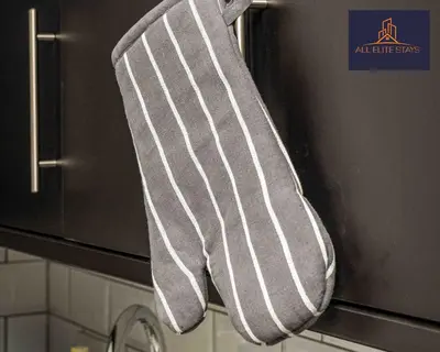 a pair of striped socks hanging on a stove at Swan House Apartment 2 - 1 Bed Apartment - Sleeps up to 4 - Free Parking - Liverpool - close to city centre - By ALL ELITE STAYS in Liverpool