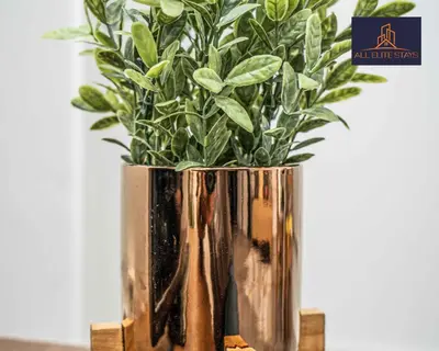 a vase with a plant in it on a table at Swan House Apartment 5 - 2 Bed Apartment - Sleeps 6 - Free Parking - Liverpool - close to city centre - By ALL ELITE STAYS in Liverpool