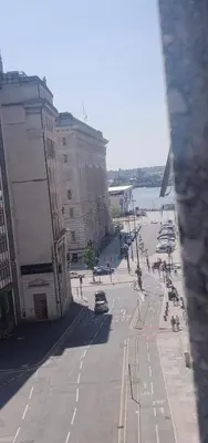 a view of a city street with people and buildings at Elegant and Sophisticated, and we mean it! in Liverpool