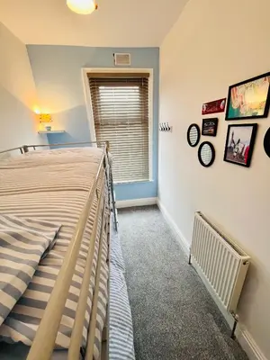 a bedroom with a bed and a window at Quirky House Blackpool in Blackpool