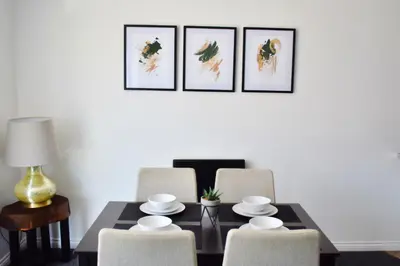 a dining room with a table and four chairs at City Center Apartments FREE PARKING in Liverpool
