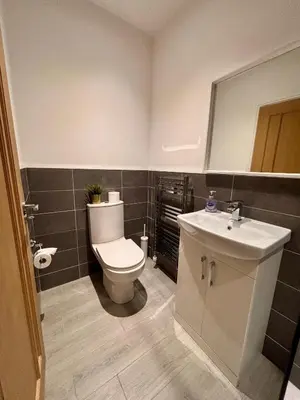 a bathroom with a toilet and a sink at Franks Apt 4 - Roof Terrace - Sleeps 6 in Blackpool